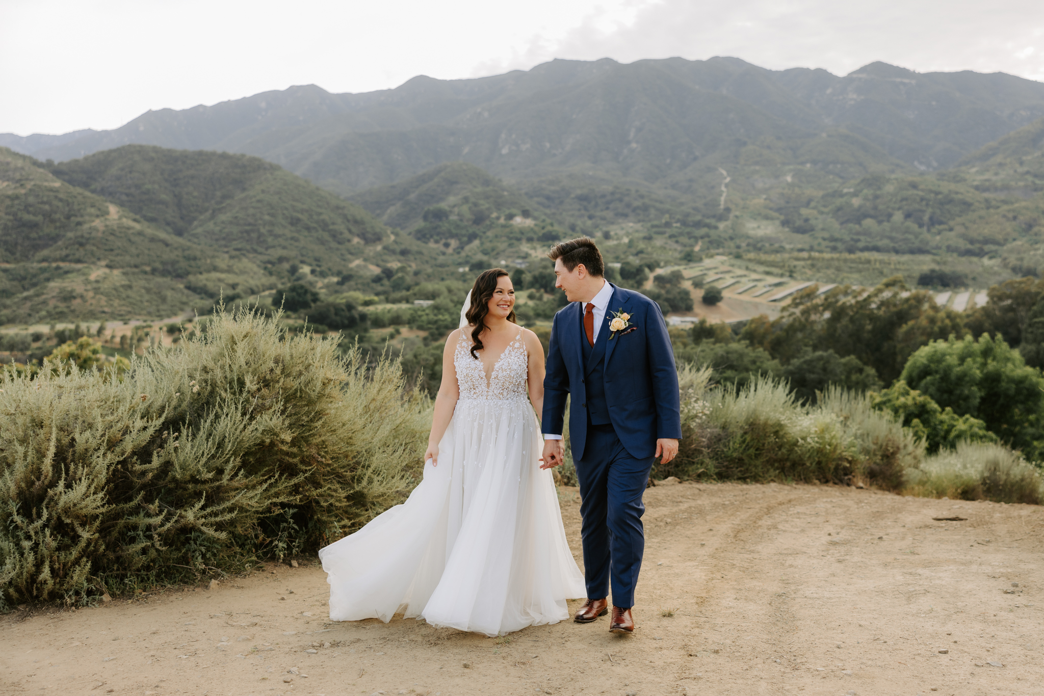 bride and groom in the mountainscape at Temecula wedding