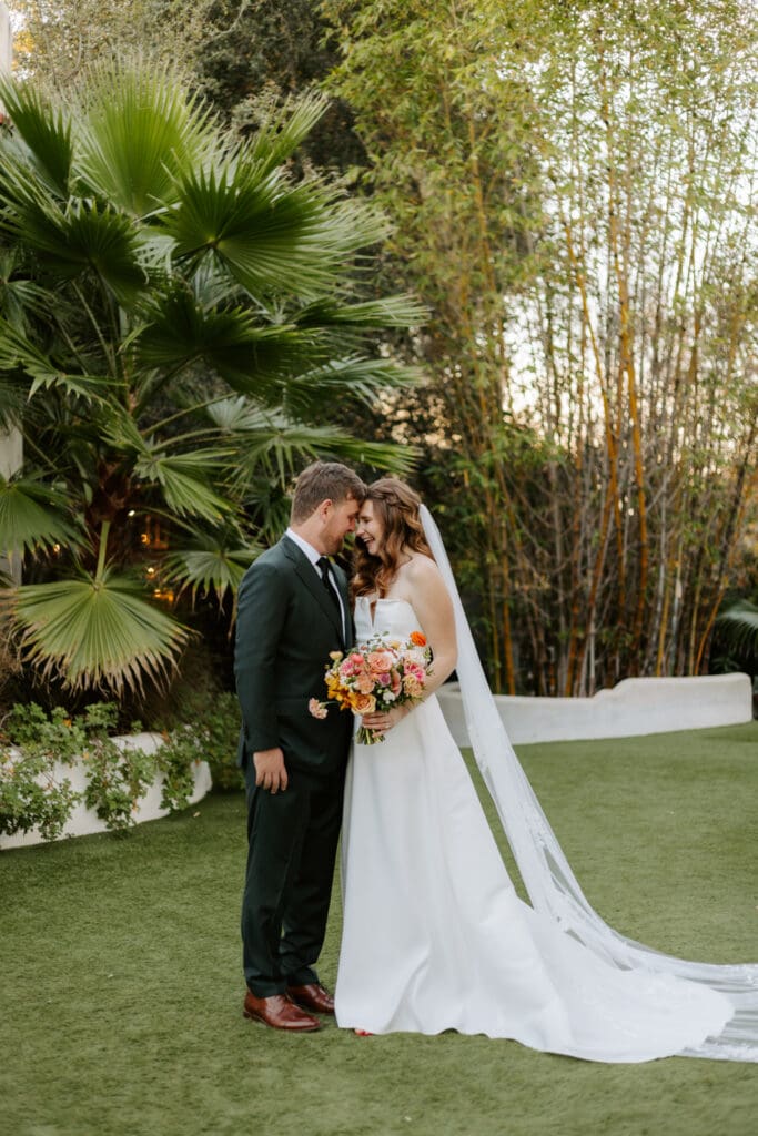 bride and groom laughing at Tivoli venue in fallbrook